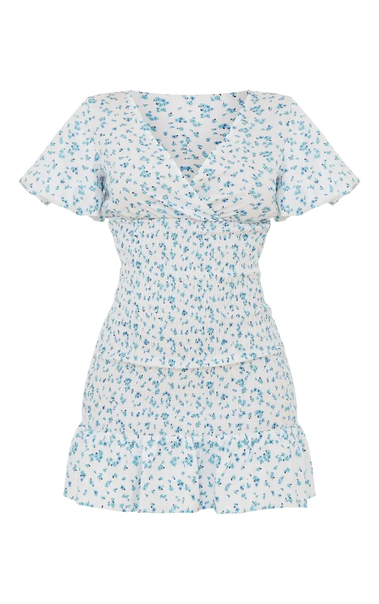 Robe moulante imprimé petites fleurs bleues froncée à col en V